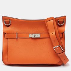 Hermes Orange Togo Leather Palladium Finish Jypsiere 37 BagHermes Jypsiere is a re interpretation of the iconic Hermes Kelly. The messenger style bag is crafted from brown Clemence leather. The bag has a round bottom and features a thick adjustable shoulder strap that provides the needed comfort. The front flap has a turn lock closure and opens to a leather lined interior that houses two slip pockets and a zip pocket. This versatile bag can be over the shoulder or crossbody. Size: Height: 31 cm, Military Outfits, Hermes Orange, Gucci Watch, Versace Watch, Jimmy Choo Sunglasses, Togo Leather, Versace Bags, The Messenger, Hermes Shoes