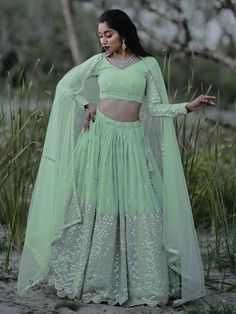 This exquisite ensemble exudes elegance and charm with its pastel green color and intricate detailing. Crafted from high-quality georgette fabric, the lehenga is adorned with zari embroidered and heavy sequin work, making it a perfect choice for weddings, receptions, engagements, and other special occasions.
The semi-stitched design allows for customization up to 42 inches, ensuring a perfect fit for every body type. The matching blouse, also made from georgette material with zari and sequin wor Green Embroidered Party Wear Dupatta, Pista Green Lehenga With Dabka Work For Eid, Pista Green Georgette Sets With Zari Work, Green Georgette Party Wear Sets, Green Georgette Sets With Intricate Embroidery, Pista Green Semi-stitched Lehenga With Dabka Work, Semi-stitched Pista Green Lehenga With Dabka Work, Pista Green Sets With Dabka Work For Reception, Pista Green Set With Dabka Work For Reception