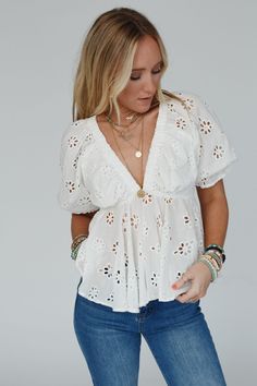 Elevate your style with the timeless and charming, Let Love Embroidered Top with details that add a touch of romance to your everyday looks! Whether dressed up or down you're going to love this unique top because it features: So pretty and unique Cotton fabric with floral eyelet details throughout Flattering deep v - neckline with cute gathered fabric details Cute short puff sleeves with elastic sleeve closures Pointed gathered babydoll - style center seam Lined along the bust for added coverage Cute V-neck Blouse For Vacation, Embroidered V-neck Top For Day Out, V-neck Tops With Floral Embroidery For Vacation, Cute V-neck Tops For Vacation, Chic Embroidered Lace Top For Spring, Chic Embroidered Top For Spring Brunch, Fitted Tops With Broderie Anglaise For Day Out, Chic Embroidered Tops For Vacation, Feminine Embroidered White Tops