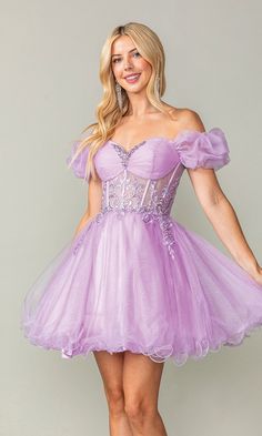 Simply delightful, this short homecoming dress 33796 is cute and sexy all rolled into one. With an off-the-shoulder sweetheart bodice, this short babydoll dress has a sheer corset waist that wraps around to the lace-up back, while adorable ruffled puff sleeves wrap around the upper arms for a romantic look at homecoming, wedding receptions, and other semi-formal events. In misses and some plus sizes, this off-the-shoulder short party dress has a glittery short a-line skirt that flows to the tren Purple Puffy Dresses Short, Purple Ruffled Mini Dress For Prom, Purple Butterfly Dress Short, Balletcore Mini Corset Dress With Ruffles, Purple Fairy Mini Dress, Corset Homecoming Dress, Dancing Queen Dresses, Short Party Dresses, Sheer Corset