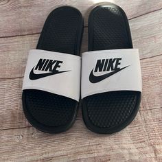 New No Tag Size 11 White And Black Sporty Slides With Round Toe And White Sole, Nike Black Slides With Rubber Sole, Black Slides With Rubber Sole, Black Low-top Slides With Rubber Sole, Black Round Toe Slides For Streetwear, Casual Black Low-top Slides, Black Casual Low-top Slides, Nike Black Sneakers For Summer, Nike Black Sporty Slides