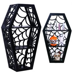 two black hexagonal shelves with halloween decorations