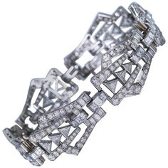 19k 7.13 inArt Deco Diamond and Platinum Bracelet | From a unique collection of vintage Link Bracelets at https://www.1stdibs.com/jewelry/bracelets/link-bracelets/. Art Deco Formal Tennis Bracelet With Brilliant Cut, Formal Art Deco Tennis Bracelet With Brilliant Cut, Formal Art Deco Diamond Tennis Bracelet, Formal Art Deco Brilliant Cut Tennis Bracelet, Art Deco White Gold Tennis Bracelet With 17 Jewels, Art Deco Diamond Jubilee Bracelet, Art Deco Diamond Tennis Bracelet With Single Cut Diamonds, Art Deco Diamond Tennis Bracelet With Brilliant Cut, Luxury Platinum Diamond Bracelet With Baguette Diamonds