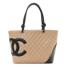 This is an authentic CHANEL Calfskin Quilted Large Cambon Tote in Beige and Black. This shoulder bag is beautifully crafted of soft diamond quilted calfskin leather in beige. The handbag features black leather rope top handles knotted at the ends, a rear patch pocket, and a largeoff-set black leather Chanel CC logo on the front. The top zipper opens to a blackChanel logo fabric interior with zipper pockets. Designer Rectangular Bag With Diamond Quilting, Designer Leather Shoulder Bag With Diamond Quilting, Elegant Leather Shoulder Bag With Diamond Quilting, Elegant Leather Bags With Diamond Quilting, Leather Bag With Diamond Quilting In Rectangular Shape, Leather Bags With Diamond Quilting, Rectangular Leather Bag With Diamond Quilting, Chic Cream Quilted Shoulder Bag, Classic Quilted Shoulder Bag For Shopping