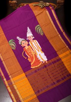 Celebrate elegance with the Plum Kanchi Cotton Saree, a beautiful creation that embodies both tradition and sophistication.  The saree features a stunningBegali Bride and Groom theme handpainted  on the pallu, meticulously detailed to reflect the grandeur and festivity of traditional celebrations. This intricate artwork showcases motifs and patterns that are symbolic of marriage ceremonies, adding a touch of cultural significance and artistry to the saree. This saree is ready to wear with fall and pico done.  *Note: There may be minor variations in the shade, the texture of the product. Hues/textures show differently due to variations in screen settings and other factors, *Note: This is a handwoven saree and there may be slight inconsistencies such as in it's weaving. These are characteris Artistic Hand-painted Saree For Festive Occasions, Artistic Hand Painted Saree For Festive Occasions, Artistic Festive Traditional Wear With Traditional Patterns, Festive Artistic Traditional Wear With Traditional Patterns, Artistic Hand Painted Festive Saree, Festive Artistic Hand Painted Saree, Traditional Multicolor Hand Painted Dupatta, Traditional Hand Painted Multicolor Dupatta, Festive Hand Painted Dupatta