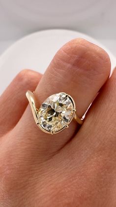 DETAILS: - natural 2 carat champagne color oval diamond - approx. O-P color, VS2 clarity - set in 14k yellow gold with 5 claw prongs and a half Victorian swirl setting - can be sized to any size complimentary! DM or email us at oriannejewelry@gmail.com with your order number to request your needed size. Champagne Diamond Engagement Ring, Champagne Diamonds Engagement, Oval Diamond Ring, Claw Prong, Champagne Diamond, Champagne Color, 2 Carat, Oval Diamond, Diamond Engagement Rings