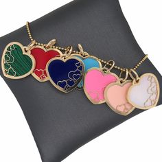 𝓦𝓮𝓵𝓬𝓸𝓶𝓮 𝓽𝓸 𝓛𝓲𝓸𝓷𝓱𝓮𝓪𝓻𝓽 𝓳𝓮𝔀𝓮𝓵𝓻𝔂 𝓢𝓱𝓸𝓹 ♥ Lovely Inlay Gemstone Padlock Heart Charms crafted in 14K Italian Gold with the choice of Red Coral, Peach Coral, Pink Paste, Lapis, Mother of Pearl, Turquoise, or Malachite. This beautiful and delicately designed multiple hearts within a heart Charm, is perfect for anyone near and dear. The Chain in the pictures are not included and for display purposes only. Please allow 1-5 weeks for delivery. *Please check measurements below, i Luxury Heart-shaped Enamel Jewelry, Multicolor Heart Cut Jewelry For Valentine's Day, Multicolor Double Heart Jewelry For Valentine's Day, Multicolor Enamel Heart-shaped Jewelry, Multicolor Enamel Heart Jewelry, Multicolor Heart-shaped Enamel Jewelry, Valentine's Day Multicolor Pendant Jewelry, Valentine's Day Multicolor Double Heart Jewelry, Multicolor Double Heart Jewelry Gift