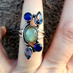 Brand New Handmade Ethnic Labradorite And Blue Topaz Silver Ring. Size 7 1/2 925 Stamped Bohemian Sterling Silver Jewelry With Accent Stones, Unique Sterling Silver Sapphire Ring With Gemstone Accents, Blue Labradorite Ring, Blue Bohemian Sterling Silver Gemstones, Blue Bohemian Jewelry With Accent Stones, Unique Blue Labradorite Ring, Blue Bohemian Moonstone Ring, Bohemian Blue Labradorite Rings, Blue Moonstone Ring With Natural Stones In Bohemian Style