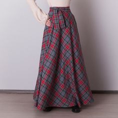 Gray plaid skirt: - Side seam pockets - Hidden zipper in the side seam - Separate sash - Classic tartan pattern - Fabric is 40% wool, 58% polyviscose, 2% of elastane Model is 6'2'', she wears US 8 size US 0  Bust 82 cm (32.5 inches) Waist 64 cm (25 inches) Hips 89 cm (35 inches) US 2  Bust 85 cm (33.5 inches) Waist 66 cm (26 inches) Hips 92 cm (36 inches) US 4  Bust 88 cm (34.5 inches) Waist 68 cm (27 inches) Hips 94 cm (37 inches)  US 6  Bust 90 cm (35.5 inches) Waist 71 cm (28 inches) Hips 96 cm (38 inches)  US 8  Bust 93 cm (36.5 inches) Waist 74 cm (29 inches) Hips 99 cm (39 inches) US 10  Bust 95 cm (37.5 inches) Waist 76 cm (30 inches) Hips 102 cm (40 inches) US 12  Bust 99 cm (39 inches) Waist 80 cm (31.5 inches) Hips 105 cm (41.5 inches) US 14  Bust 103 cm (40.5 inches) Waist 84 cm Plaid Skirt With Pockets For Winter, Scottish Plaid Skirt For Winter, Scottish Style Plaid Winter Bottoms, Winter Scottish Plaid Skirt, Plaid Skirt With Pockets, Long Tartan Skirt Outfit, Tartan Skirt Outfit, Gray Plaid Skirt, Grey Plaid Skirt