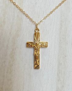 The charm measures 1 1/4" The chain measures 14" Handmade Gold-Filled charm, clasp, and chain Final sale, no exchanges nor returns will be available Gold Plated Crucifix Necklace Tarnish Resistant, Gold Plated Tarnish Resistant Crucifix Necklace, Classic Cross Jewelry With Adjustable Chain, Gold-plated Tarnish-resistant Crucifix Necklace, Classic Gold Crucifix Jewelry, Spiritual Yellow Gold Chain Necklace, Classic Cross Pendant Jewelry With Adjustable Chain, Gold Plated Crucifix Jewelry With Adjustable Chain, Sterling Silver Chain Necklace With Cross Pendant