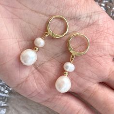 Classic dainty real natural pearl dangle earrings with gold hoop clip-on huggies. 7mm and 5mm ivory freshwater pearls have beautiful natural shine, every pearl is unique in its texture and shape, super elegant and classic. Great accessory for bridal bridesmaid wedding earrings, amazing gift idea for your loved one, they also look perfect with everyday outfit! 💎 Features: ♥ Material:14K Gold plated sterling silver, brass ♥ Main stone: 5mm, 7mm natural freshwater pearl, each pearl is unique ♥ Clip-on Closure 💎 Details: ♥ Approximate Measurements: - Length: 3.4 cm - Width: 1 cm ♥ Lightweight, easy to wear ♥ Nickel/Lead Free, Hypoallergenic, good for sensitive skins 🎁 Packing & Shipping: ♥ All our jewelry will be shipped with beautiful gift wrap packaging ♥ Handwrite gift notes/cards availa Delicate Pearl Earrings With Pearl Pendant, Pearl Charm Huggie Jewelry For Anniversary, Delicate Pearl Earrings With Pendant, Gold Pearl Huggie Jewelry, Delicate Gold Hoop Earrings With Pearl Charm, Huggie Pearl Charm Jewelry For Anniversary, Elegant Huggie Clip-on Earrings, Dainty Yellow Gold Hoop Earrings With Pearl, Anniversary Huggie Jewelry With Pearl Charm