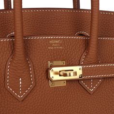 This Birkin is in Gold togo leather with gold hardware and features contrast stitching, front flap, two straps with center toggle closure, a clochette with lock and two keys and double rolled handles.The interior is lined with Gold chevre and has one zip pocket with an Hermes engraved zipper pull and an open pocket on the opposite side.Collection: WOrigin: FranceCondition: New and never worn (plastic on hardware) Accompanied by: Hermes box, Hermes dustbag, clochette, lock, two keys, clochette du Top Handle Bag With Metal Hardware In Epsom Leather, Epsom Leather Bag With Metal Hardware And Top Handle, Top Handle Epsom Leather Bag With Metal Hardware, Epsom Leather Top Handle Bag With Metal Hardware, Classic Epsom Leather Bag With Branded Hardware, Gold Epsom Leather Travel Bag, Business Bags In Togo Leather, Timeless Epsom Leather Bag With Branded Hardware, Timeless Bags With Metal Hardware And Togo Leather