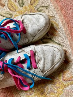 Super rad 1980s Balloon brand sneakers! White leather with double laces Teal and pink I found them this way you can switch them out if you want or keep as is I love the double laces Thick man made rubber sole Leather upper Normal wear and tear on heels and toes Still has some tread on bottom Check last photos for flaws No size but these fit my size 8’s with no socks with some room so I’m guessing a womens 8-8. 5 would fit Measurements taken are Insole: 10 in Outersole: 10. 5 in Width: 3. 5 in Retro Custom Lace-up Sneakers With White Sole, Vintage Sneakers With Laces And White Sole, Vintage Custom Lace-up Sneakers With Rubber Sole, Vintage Lace-up Custom Sneakers With Rubber Sole, Vintage Cotton High-top Sneakers With Rubber Sole, White Leather Tennis Shoes, Balloon Shop, Teal And Pink, Sneaker Brands