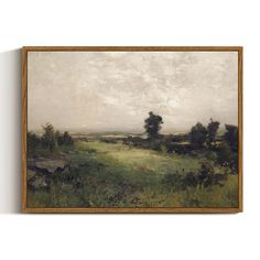 a painting hanging on the wall above a green field with trees and grass in it