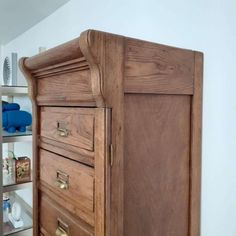 a wooden dresser with drawers in a room