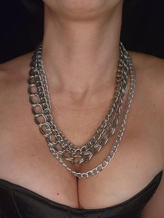 4 different chains linked together to create this necklace.  Large lobster claw closure at the back.  Measures about 20 inches long.  Handmade and unisex jewelry.  Ready to ship. To continue shopping: http://www.rrrobinnn.etsy.com Silver Chain Link Layered Necklace, Silver Chunky Chain Multi-strand Layered Necklace, Silver Multi-strand Chunky Chain Layered Necklace, Silver Multi-strand Chunky Chain Necklace, Silver Multi-strand Layered Necklace With Chunky Chain, Silver Multi-strand Necklace With Chunky Chain, Silver Chunky Multi-strand Necklace, Metal Layered Necklace With Chunky Chain, Edgy Silver Double Chain Necklace