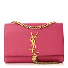 This is an authentic SAINT LAURENT Calfskin Small Classic Monogram Kate Tassel Satchel in Lipstick Fuchsia. This ultra-stylish evening bag is finely crafted of smooth calfskin leather in vibrant pink. The bag features a gold bijoux chain shoulder strap and a frontal flap with a gold YSL logo and a hanging miniature chain tassel. The flap opens to a black suede interior with a small patch pocket. Kate Bags, Classic Monogram, Ysl Logo, Saint Laurent Bag, Black Suede, Evening Bags, Patch Pocket, Camera Bag, Calf Skin