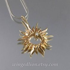 Elegant Sterling Silver Sun Design Jewelry, Celestial Jewelry With Sun Design Round Pendant, Celestial Sun Design Round Pendant Jewelry, 14k Yellow Gold Sun Design Jewelry, 14k Yellow Gold Jewelry With Sun Design, Sterling Silver Jewelry With Sun Design In Yellow Gold, Elegant Sunburst Jewelry With Sun And Moon Design, Elegant Sunburst Jewelry With Sun Design, Elegant Sun And Moon Design Sunburst Jewelry