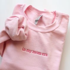 In my mom era Embroidered Sweatshirt - Cotton and polyester blend - Unisex fit - The design is embroidered  C A R E : I recommend turning the item inside out and wash cold on delicate cycle. Air dry for best result. Do not iron directly on the embroidery surface. PLEASE NOTE  - Actual color may vary due to variations in display settings. - Please check out our size chart for measurements to ensure an accurate fit. - Sales are final. No returns, exchanges or refunds. Please feel free to ask if you have any questions. ★ Click here to see more crewnecks in my shop : https://etsy.me/3qQd7Ya Embroidered Mom Sweatshirt, Pink Sweatshirt Embroidered, Pink Embroidered Relaxed Fit Sweatshirt, Mother's Day Embroidered Crew Neck Sweatshirt, Mother's Day Embroidered Cotton Sweatshirt, Pink Crewneck Sweatshirt, Pink Crewneck, Embroidered Sweatshirts, Personalized Shirts