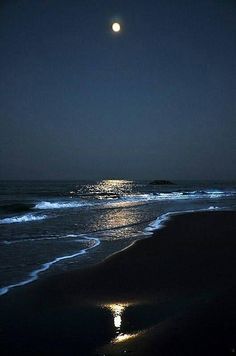 the moon is shining brightly over the ocean