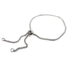 "This is a rolo chain with a loop at each end and a sliding silicone center smart bead.  Create a beautiful bracelet by adding a beads to the end loops with wire, or in other creative ways! Size:  Smart bead measures 5/16\" across (8mm); chain measures 9.5\" long (24cm) Color:  Silver Quantity:  one rolo chain and a silicone smart bead Material:  stainless steel, silicone insert in smart bead Colors may vary slightly due to differences in computer monitors. You can watch a demo for design ideas Bracelet Chain, Dec 30, Beaded Material, Rolo Chain, Computer Monitors, Bead Bracelet, Beautiful Bracelet, Chains Necklace, Silver Tone