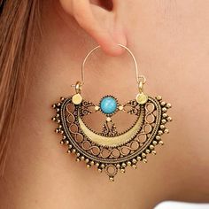 “Turquoise Gypsy Hoops” Bollywood Indian Tibetan Tribal Ethnic Palace Empress Ornate Elaborate Infinity Dots Lacey Cut-Out Bohemian Hippie Upscale Extravagant Elegant Exquisite Gold Dangle Earrings. Fantastic Ornate Lacey Cut-Out Hoops With Various Stacked/Alternating Patterns, Including A Chain Of Infinity Signs, Ball Bead Dots, & 3 Curlicue Pillars That Display A Central Round Blue Turquoise Stone. New. Measurements: Eardrop Length: 1.9” Earring Width: 1.8” If You Want It, Don’t Let It Get Awa Blue Drop Earrings, Accessories Aesthetic, Fashion Geometric, Vintage Bohemian Style, Casual Earrings, Vintage Style Earrings, Beaded Jewels, Beaded Drop Earrings, Bohemian Earrings