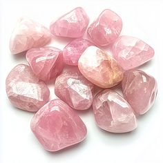 Small Group of Rose Quartz Tumbled Stones on a bright white background Pink Rose Quartz Crystals For Spiritual Use, Pink Rose Quartz Spiritual Crystals, Pink Rose Quartz Healing Crystals, Spiritual Pink Rose Quartz Crystals, Pink Healing Gemstone Crystals, Spiritual Pink Crystals Gemstone, Pink Spiritual Gemstone Crystals, Pink Natural Stones Crystals For Healing, Pink Rose Quartz Crystals For Gift