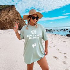 Introducing our "Beach Baby on Board" Comfort Colors shirt, perfect for your summer pregnancy announcement by the sea. Whether it's a cruise or beach vacation, share your joy in style. Ideal for baby showers or gender reveals, its soft fabric ensures comfort while flaunting your bump. Blue Tops For Beach With Upf 50+, Blue Beach Tops With Upf 50+, Beach Tops With Sun Protection And Short Sleeves, Short Sleeve Tops With Upf 50+ For Beach, Upf 50+ Short Sleeve Tops For Beach, Summer Tops With Upf 50+ For Beach Season, Beachy Tops With Upf 50+ For Vacation, Casual Tops With Upf 50+ For Beach, Vacation Tops Upf 50+ For Beach Season