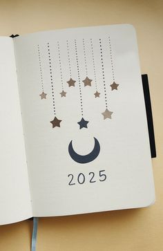 an open notebook with stars and crescents hanging from it