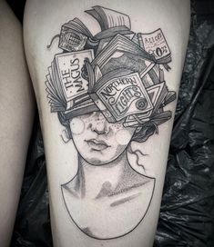 a black and white photo of a woman's face with books on her head