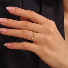 Embrace divine grace with our Dainty Cross Ring, a delicate and meaningful piece that symbolizes faith and spirituality. It features a dainty cross design, elegantly rendered in lustrous gold. The minimalist style adds a touch of modernity, while the symbolic cross represents devotion, hope, and love. Whether worn as a personal reminder of faith or as a fashionable accessory, our Dainty Cross Ring is a timeless choice that exudes both elegance and spiritual significance. - Made in 14k solid gold Elegant Cross-shaped Promise Ring, Simple Gold Initial Open Ring, Gold Initial Ring With Simple Design, Gold Initial Ring Simple Design, Delicate Gold Initial Ring With Simple Design, Elegant Gold Cross Ring, Elegant Yellow Gold Initial Ring With Simple Design, Minimalist Cross Rings For Gifts, Dainty Jewelry Rings