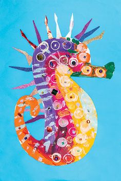 a colorful seahorse made out of paper on a blue background