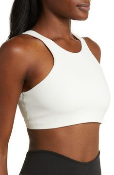 Get into your groove in this ultracomfy sports bra with signature Dri-FIT tech and a breezy back cutout to keep you cool and dry. Racerback Dri-FIT moisture-wicking technology Lined 80% polyester, 20% elastane Machine wash, line dry Imported Versatile White Sports Bra With 4-way Stretch, Breathable Compressive Cropped Sports Bra, Compressive Breathable Cropped Sports Bra, Compressive Cropped Breathable Sports Bra, Nike Sporty Seamless Activewear, Versatile Sports Bra For Training, Sporty Nike Activewear, Versatile White High Stretch Sports Bra, Functional Cropped Moisture-wicking Sports Bra