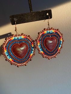 Beautiful hand beaded earrings made of high quality beads. A truly stunning pair of earrings!  Fishhooks are 18kt gold.