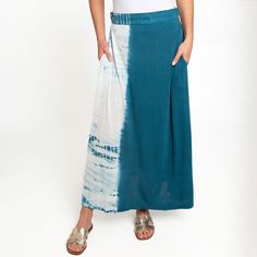 A summer essential, the Akari Tie Dye Maxi Skirt features a vibrant hand tie dyed fabric - each piece is unique! Lightweight and easy to wear with hidden side pockets, this maxi skirt is perfect for those warm summer nights. Perfect as a boho summer skirt for women thanks to the soft flowing material and the fun color. Endless versatility and unfettered comfort make this the maxi skirt you'll reach for time and time again! On casual days, work days, nights out, date nights, to parties, this ankl Hippie Tie-dye Skirt For Beach, Hippie Tie-dye Skirt For The Beach, Bohemian Relaxed Fit Skirt For Summer, Bohemian Relaxed Fit Summer Skirt, Summer Bohemian Batik Print Skirt, Bohemian Batik Print Skirt For Summer, Bohemian Batik Print Summer Skirt, Bohemian Maxi Skirt With Pockets For Beach, Bohemian Wide Leg Maxi Skirt With Pockets