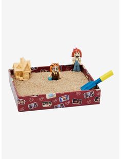 a sandbox with two people playing in it