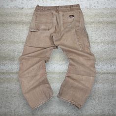 Vintage Dickies Carpenter Pants Camel Tan Canvas Baggy Fit Dungarees Work Wear Painters 90s Skate / Streetwear Great Condition: 7/10 (small marks, aka some character) Men's Size:  Waist: 36" Length (inseam): 34" Leg Opening: 8.5" Thigh Opening: 13" Front Rise: 13" 90s Style Cargo Pants With Pockets For Fall, 90s Baggy Straight Leg Parachute Pants, 90s Wide Leg Parachute Pants With Pockets, Beige Baggy Cargo Jeans For Streetwear, 90s Wide Leg Pants With Cargo Pockets, Vintage Baggy Cargo Jeans With Pockets, 90s Style Wide Leg Pants With Cargo Pockets, 90s Cargo Style Bottoms For Fall, 90s Style Bottoms With Pockets For Fall