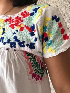 "Elegant dress and colourful hand-embroidery. Perfect for mexican wedddings, mexican parties, etc. Made in the 80's Loose fit In perfect conditions. Fits size Small Measurements taken flat: Armpit to armpit 20 1/2\" Bottom hem width 29 1/2\" Shoulder to bottom hem 49\"" Multicolor Folk Dress With Intricate Embroidery, Pink Folk Dress With Floral Embroidery, Fiesta Embroidered Cotton Dress With Multicolor Embroidery, Multicolor Embroidered Cotton Folk Kaftan, Traditional Cotton Embroidered Fiesta Dress, Mexican Boho, Short Sleeve Tunic, Mexican Dresses, Mexican Party