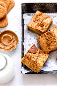 several pieces of bread on a tray with peanut butter