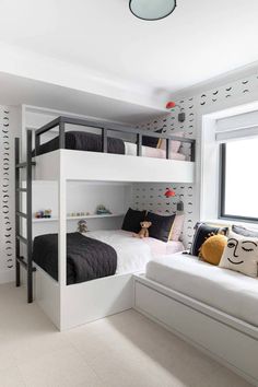 a bedroom with bunk beds and white walls