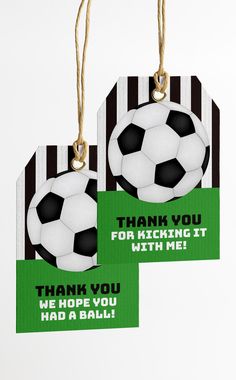 two tags with soccer balls and thank you for kicking at the same time on them