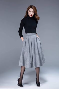 "A short wool skirt for autumn, winter. A simple work skirt. DETAIL * 30% wool, 30% fiber, 40% polyester * fully satiny lining, more nice to the touch body * Seam pocket * Right zipper closure * Below knee length * Wash by hand or machine with cold water SIZE GUIDE Size vary between Brand and Country Please get your body measurement with our Size Guide And Find your size in our Size Chart Size Guide https://www.etsy.com/listing/722950722 SIZE CHART https://www.etsy.com/listing/736810337 This Vid Office Midi Skirt, Flare Skirts, Midi Skirt Winter, Feminine Clothing, Skirt Winter, Classic Clothes, Business English, Rocker Chick, Tailored Clothes