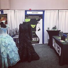 there are two dresses on display at this event, one is blue and the other is black