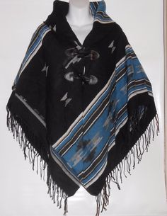 Claire's Ladies Shawl Collar Fringed Cape Wrap Poncho Black Multi O/S NWT Click to Enlarge Click to Enlarge Up for consideration from CLAIRE'S LADIES SHAWL COLLAR FRINGED CAPE WRAP PONCHO IN ONE SIZE FITS MOST (O/S) SHAWL COLLAR FRINGED TOGGLE BUTTONS CLOSURE ACRYLIC BLEND LINED 50" X 60" X 3" COLOR: BLACK MULTI SHAWL COLLAR FRINGED OUTER EDGE TWO (2) FAUX LEATHER TOGGLE BUTTON CLOSURE LINED 65% ACRYLIC - 35% POLYESTER HAND WASH - HANG TO DRY MEASUREMENTS: (ACCORDING TO THE TAG) 50" X 60" X 3" N Bohemian Black Poncho For Fall, Black Shawl Outerwear For Festival, Black Shawl Poncho One Size, Black Cape For Fall Festivals, Black Fall Festival Cape, Black Bohemian Poncho One Size, Black Long Sleeve Poncho For Beach, Black Long Sleeve Beach Poncho, Casual Black Poncho For Winter