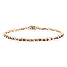 This is part of Chairish’s Fine Jewelry assortment.  This Ruby and Diamond Sleek Tennis Bracelet in 18K gold showcases 1.7 carats endlessly sparkling natural ruby and 1.26 carats of diamonds. It measures 7.5 inches long in length.  Ruby improves mental strength.  Designed with perfect square cut ruby alternatingly set with a diamond to make you stand out on any occasion or event. The elegant style complements the attire beautifully and is a perfect Engagement Gift, Bridal Shower Gift, Gift For L Classic Ruby Gemstone Tennis Bracelet, Classic Ruby Tennis Bracelet For Anniversary, Ruby Tennis Bracelet In Yellow Gold For Anniversary, Yellow Gold Ruby Diamond Jubilee Bracelet, Yellow Gold Ruby Tennis Bracelet For Anniversary, Anniversary Ruby Tennis Bracelet In Yellow Gold, Classic Ruby Tennis Bracelet For Formal Occasions, Elegant Ruby Tennis Bracelet In Yellow Gold, Classic Red Ruby Diamond Bracelet