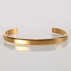 Fulfilled by our friends at Vintage Gentlemen Add to your style with our with our mens gold stainless steel cuff bracelet. This is the perfect accessory to accentuate your look and add a touch of class and sophistication. This gold cuff bracelet is designed to be worn frequently, whether a casual day, at the office, or a night out. -Water, sweat and heat resistant-Premium 316L Stainless, 18k Gold & Rhodium Base-No Discolouring or Tarnishing-Hypoallergenic – No green skin-Handmade-1 Year Warranty Gold Stainless Steel Cuff Bracelet, Tarnish Resistant, Classic Gold Stainless Steel Cuff Bracelet, Gold Stainless Steel Tarnish-resistant Cuff Bracelet, Gold Tarnish-resistant Stainless Steel Cuff Bracelet, Modern Gold Stainless Steel Cuff Bracelet, Adjustable Gold Stainless Steel Cuff Bracelet, Vintage Gentleman, Vase Holder, Silver Highlights