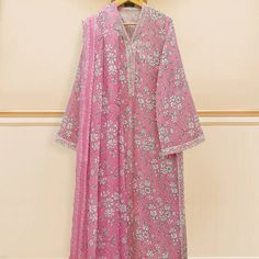 Pink Color Cotton Material New Elegant V-neck Floral Print Kurta, V-neck Floral Print Dress For Eid, Feminine Floral Print Festive Dresses, Festive Feminine Floral Print Dresses, Elegant Cotton Dresses For Eid, Elegant Cotton Dress With Dupatta, Cotton Party Dresses For Eid, Spring Wedding Dress With Printed Motifs, Summer Pink Floral Print Kurta