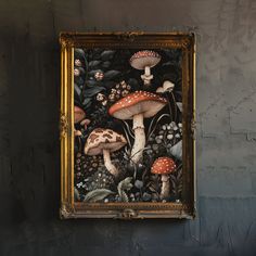 there is a painting on the wall that has mushrooms and plants painted on it with gold frame