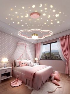 a bedroom with pink bedding and stars on the ceiling, lights above the bed