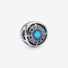 a silver and blue bead with an eye in the center on a white background